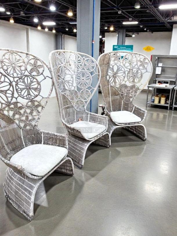Set of 3 designer outdoor wicker lounge chairs with high-back design. Intricate floral pattern, pristine condition, ready to use.