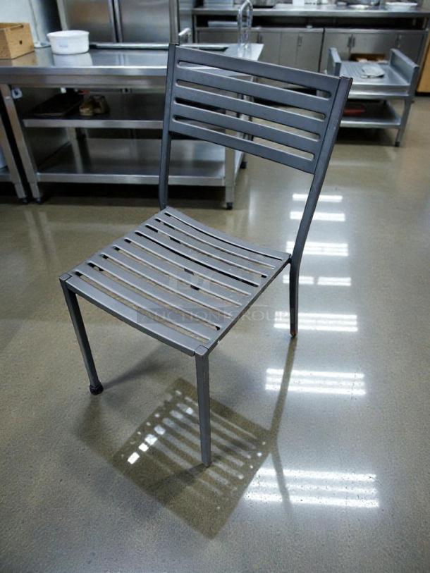Commercial metal patio chair, immaculate condition, slatted design, fully inspected, ready to use, commercial grade.