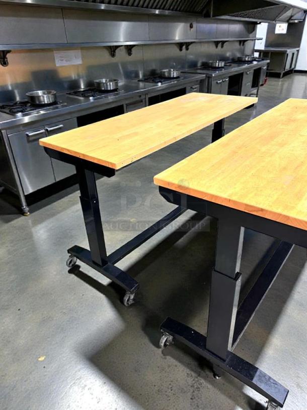 Four commercial-grade solid wood prep/work tables on wheels, outstanding condition, heavy-duty design, inspected and ready to use.