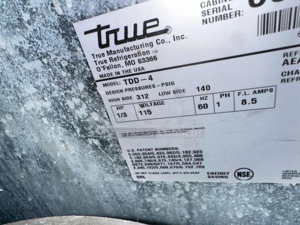 True TDD-4 draft beer dispenser label, showcasing model, design pressures, 115V voltage, 60Hz, tested and working.