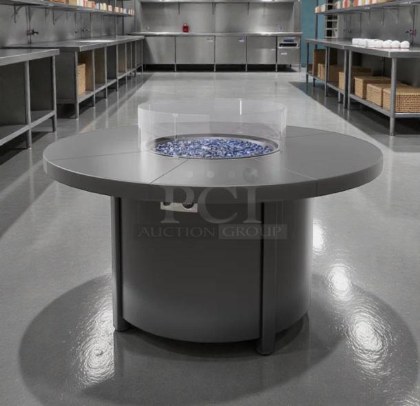 Round gas fire pit table in pristine condition, suitable for natural gas or propane. Brand: Outdoor Living/Commercial Patio.