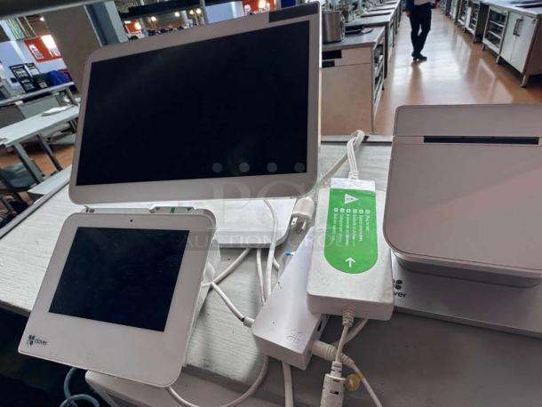 Clover Station POS system in pristine condition, featuring dual screens, card reader, and 120V power supply, fully tested and working.