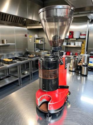 Premium condition commercial coffee grinder, 120V, red, in stainless steel kitchen. Fully tested and working.