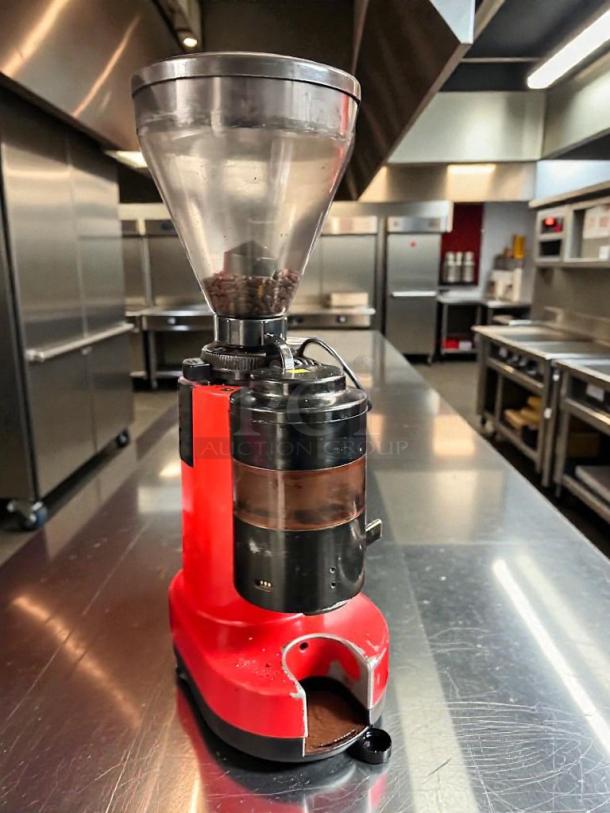 Commercial coffee grinder, red body, premium condition, 120V, fully tested and working, visible coffee beans in hopper.