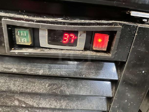 Close-up of the Supera G1M-16-B-1 control panel showing a digital display at 37°F, indicating optimal refrigeration.