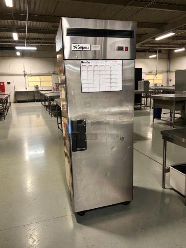 Supera FIR-1 commercial upright freezer in pristine condition, 115V. Stainless steel with visible Supera logo and monthly planner.