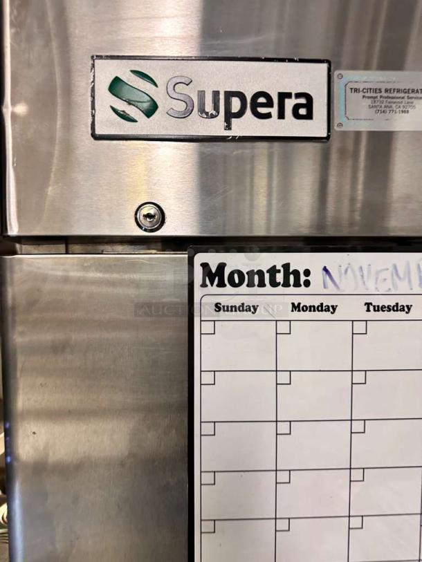 Supera FIR-1 upright freezer in pristine condition, stainless steel exterior, 115V, fully tested. Visible brand logo.