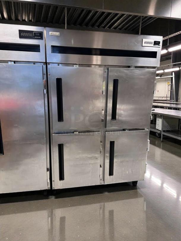Delfield 6000XL four-door reach-in commercial freezer, excellent condition, 115V, fully tested, stainless steel exterior.
