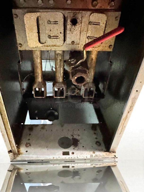 Pristine Frymaster FES35T0ZN0ZZNG gas fryer interior view, natural gas, fully tested, showing burners and wiring.