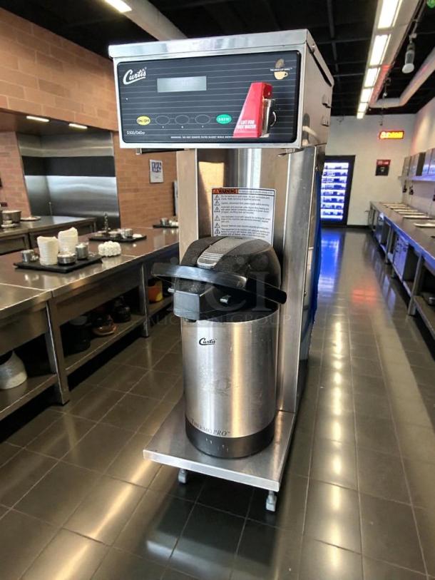 Curtis D500GT12A000 commercial coffee brewer in pristine condition, 120V, fully tested, featuring sleek design and labeled controls.