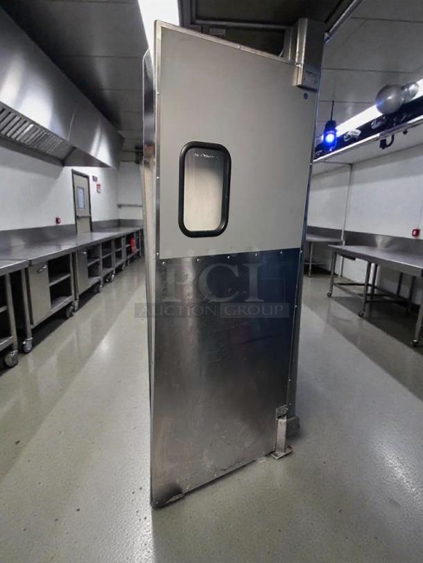 Eliason Hangar 19 commercial walk-in door in outstanding condition. Features durable metal construction, inspection window, and tested functionality.