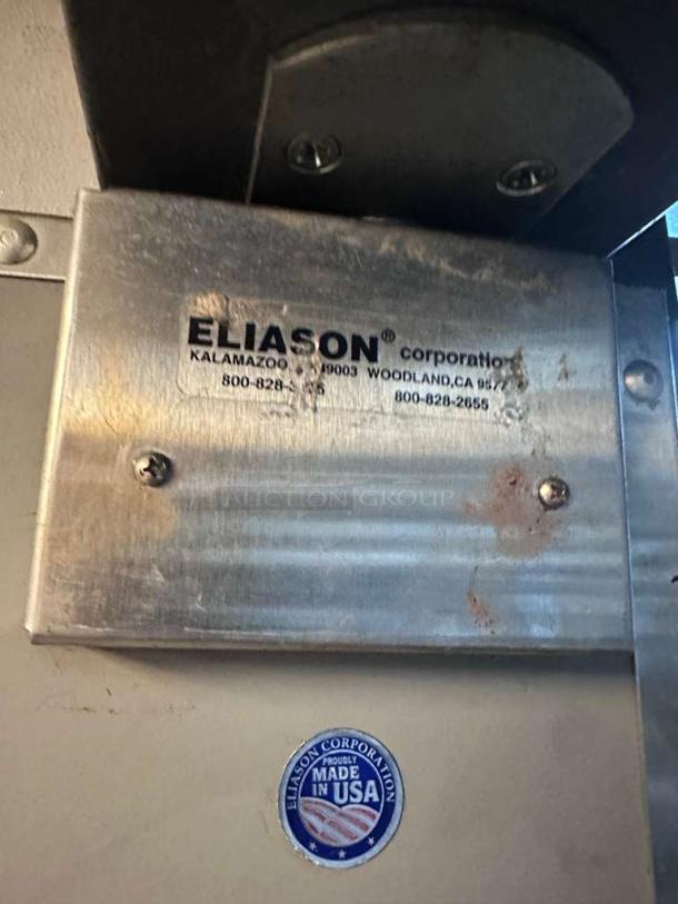 Eliason Hangar 19 commercial walk-in traffic door, stainless steel, outstanding condition, Made in USA label visible.