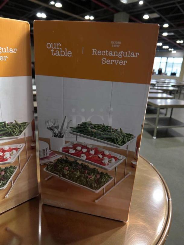 Our Table Hayden 3-Step Rectangular Server in pristine condition; ideal for buffets. Fully inspected, ready to use.