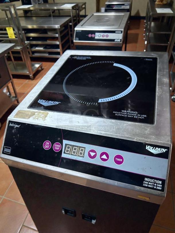 Vollrath 69503 induction range, pristine condition, 208/240V, countertop model with digital controls and warning labels.