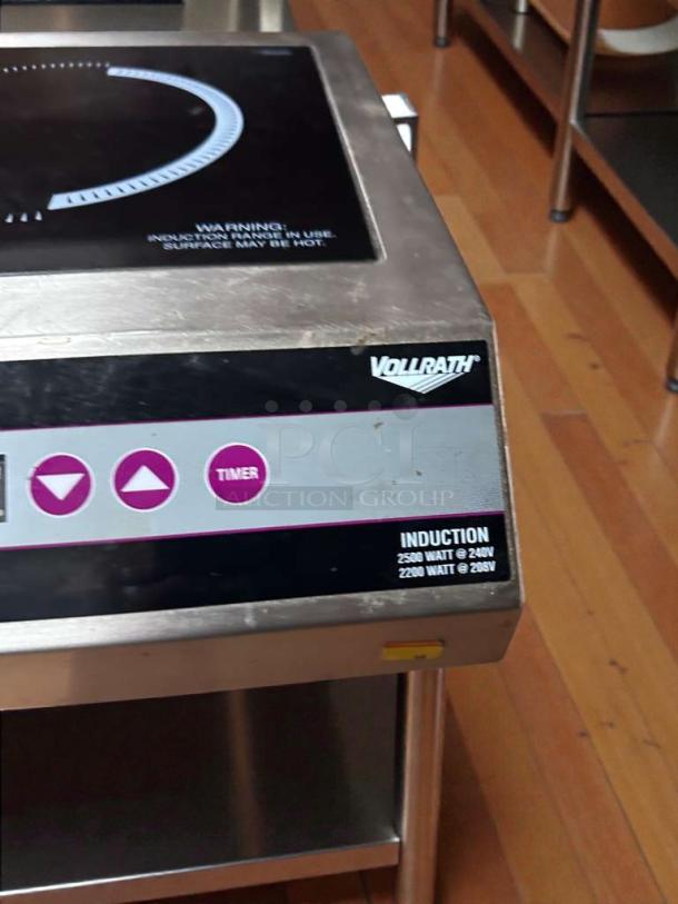 Vollrath 69503 induction range, pristine condition, 208/240V, countertop model with clear control panel and visible brand markings.