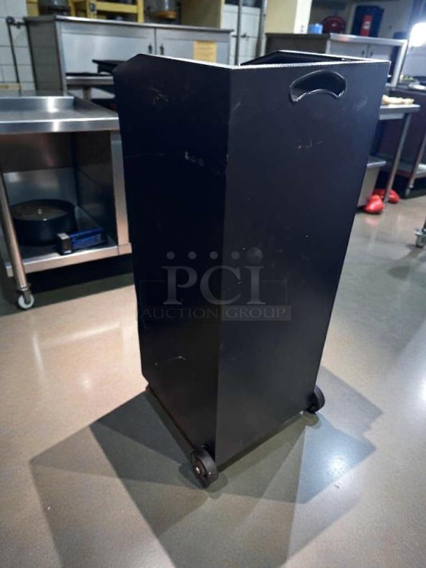 Black restaurant server station cabinet in pristine condition, with wheels and handles, fully tested and ready for use.