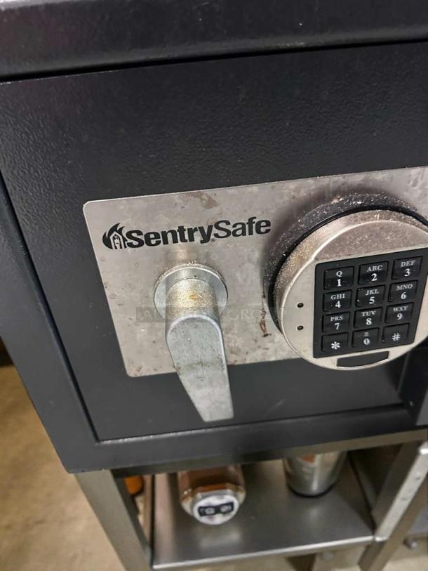 SentrySafe drop deposit safe with electronic keypad, very good condition, fully tested and working, visible SentrySafe logo.