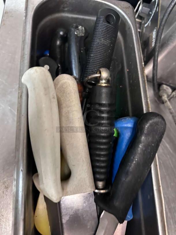 Assorted commercial kitchen knives in container, featuring mixed brands, premium condition, fully inspected, ready for use.