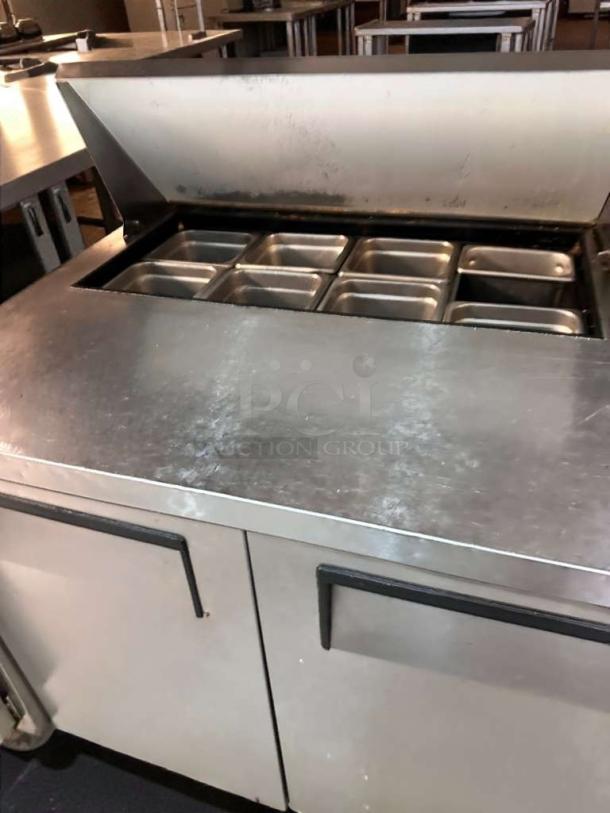 True TSSU-36-08 refrigerated sandwich prep table, very good condition, features stainless steel top with eight compartments, fully tested.