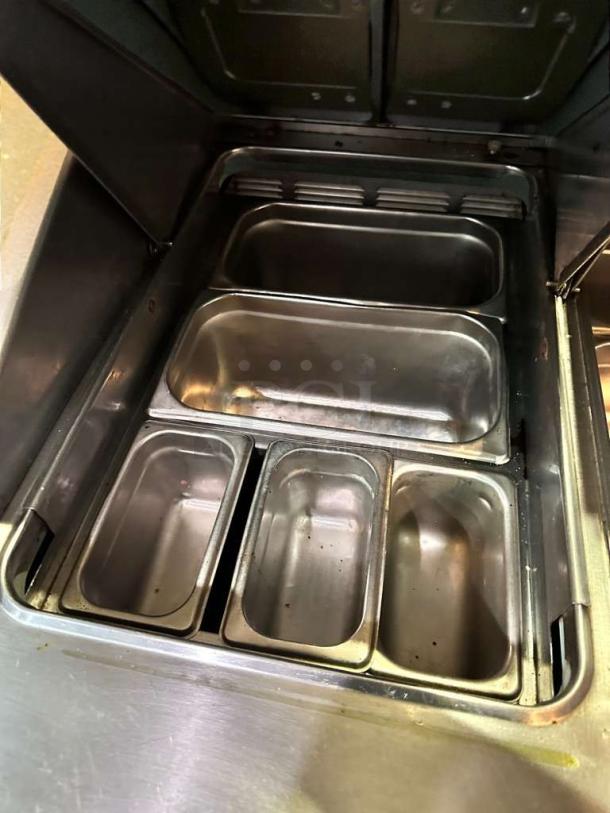 Delfield TSSU-36-08 refrigerated prep table, very good condition, 115V, with stainless steel pans, fully tested and working.