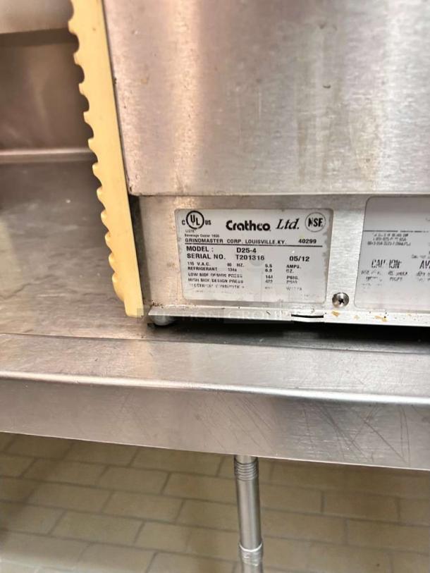 Crathco D25-4 dual beverage dispenser, outstanding condition, 115V; model and serial number tag visible, fully tested.