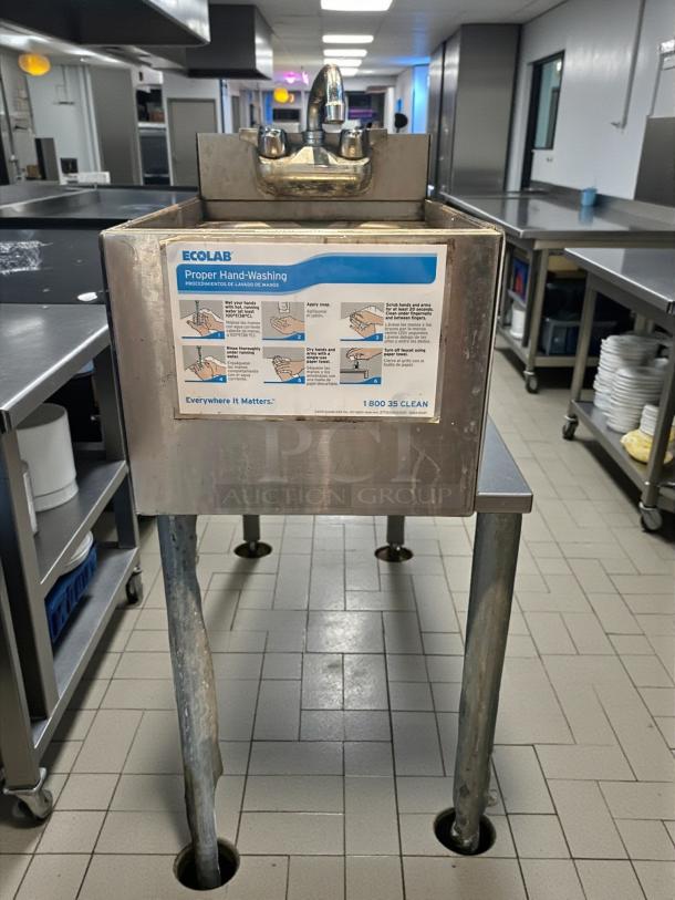 Krowne KR19-12DS 12" underbar dump sink in stainless steel, excellent condition, with faucet and hand-washing instructions.