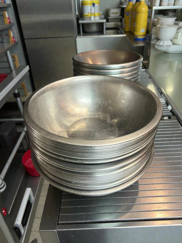 Browne 10 1/2" mixing bowl in good condition, stainless steel, stack of five, smooth interior, ribbed exterior.