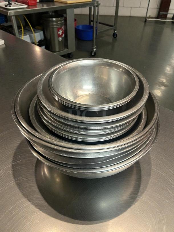 Stainless steel mixing bowls by Choice, sizes 9.5”-16.5” diameter, superb condition, stackable design.