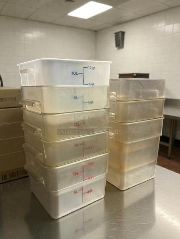 Cambro clear square food storage containers, 12 and 18 quart sizes, stacked on a kitchen counter, great condition.