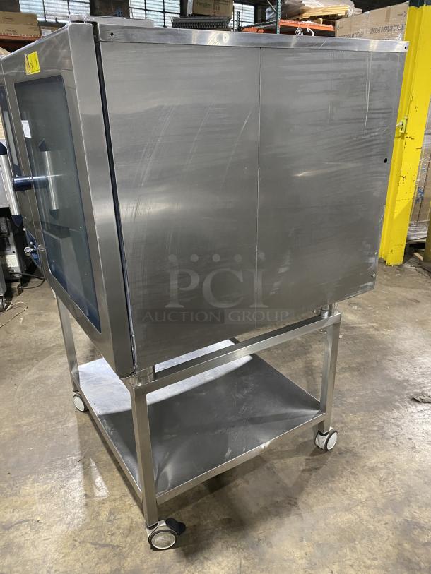 Alto-Shaam stainless steel gas combi oven Model CTP720G with equipment stand, good condition, on wheels, 120V 1 Phase.