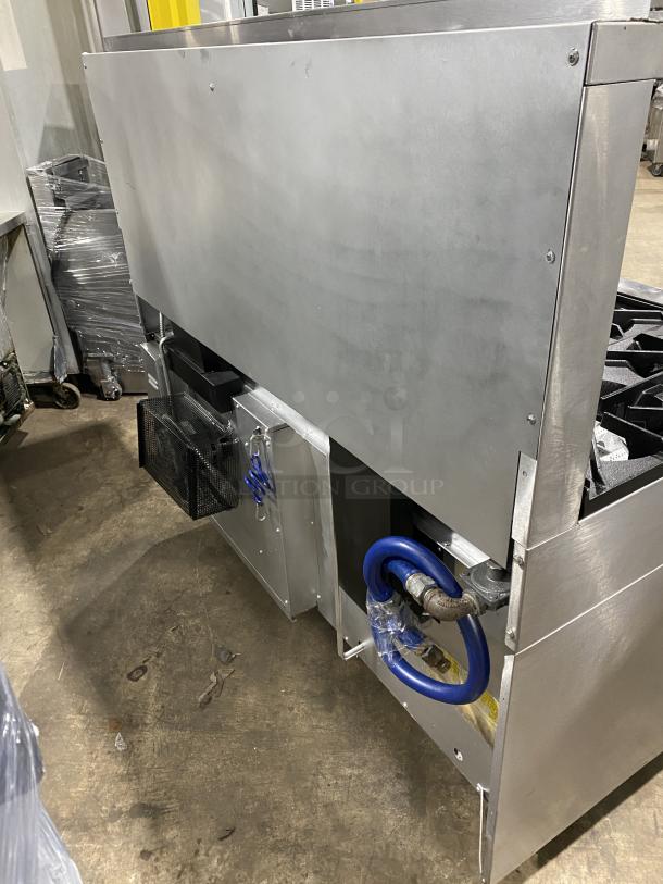 U.S. Range Performer Series commercial stainless steel 10-burner range/double oven, Model PS102626RC, on casters.