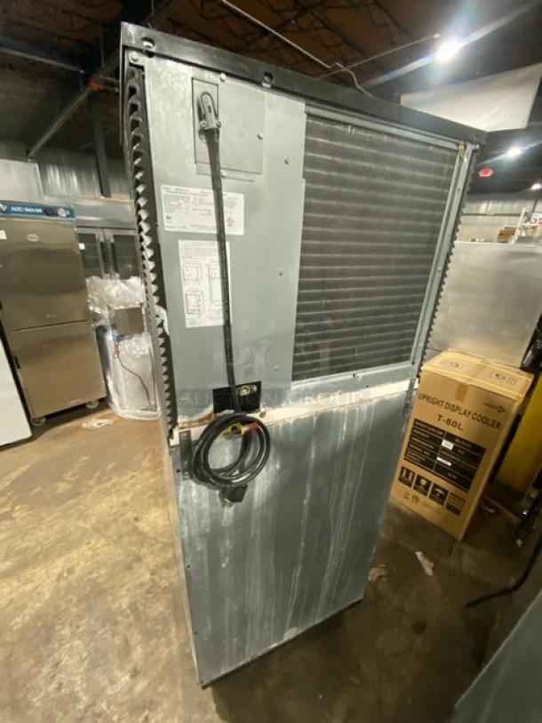 Manitowoc IR0850A-261 ice machine and bin combo, stainless steel, electric, air-cooled, 208-230V, on legs, serial number 1101128930.