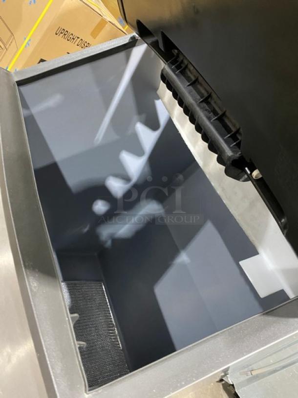 Manitowoc stainless steel ice machine/bin combo, model IR0850A261, in excellent condition, features air-cooling, on legs.