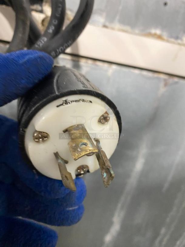 Manitowoc electric ice maker plug detail, Model IR0850A261, showing pronged design. 208-230V, 1 Phase, commercial use.