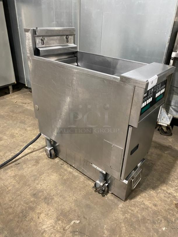 Pitco SFSE14S stainless steel electric deep fat fryer with basket hanger, filtration system, and back splash. On casters.