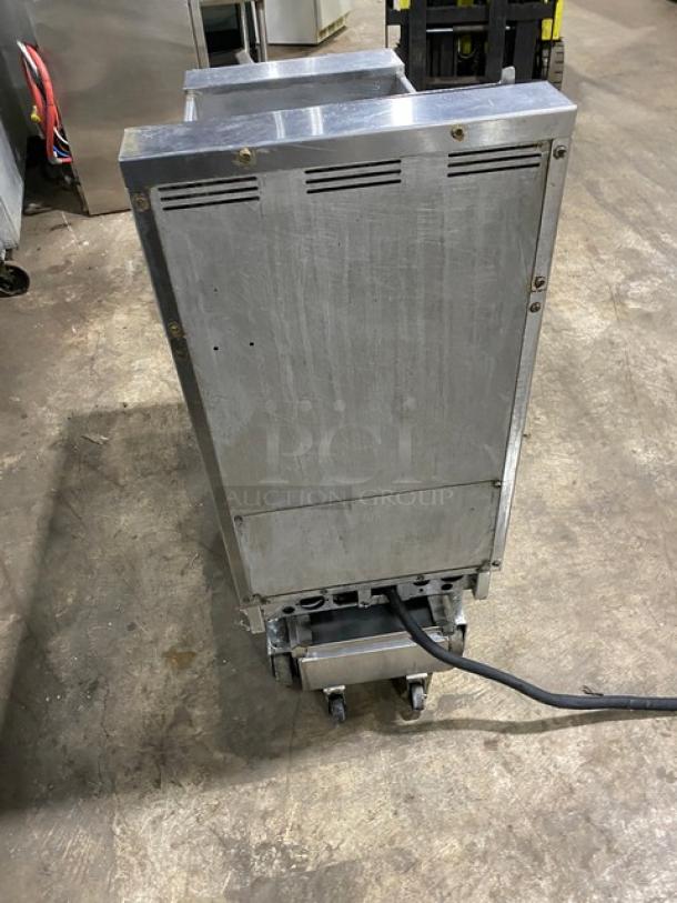 Pitco SFSE14-S commercial electric fryer, stainless steel, with backsplash, basket hanger, filtration system, on casters.