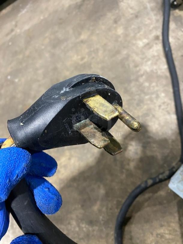 Close-up of a 208V 3-phase power plug, part of a Pitco SFSE14S commercial deep fat fryer.