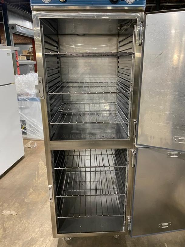 Alto-Shaam 1200UPSR stainless steel dual-compartment heated cabinet, visible wired racks, on casters, with compartment controls.