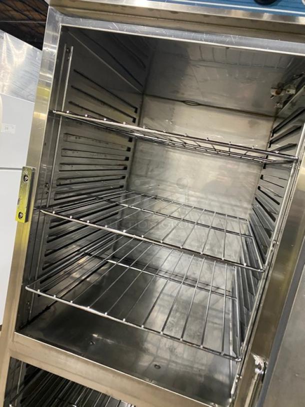 Stainless steel Alto-Shaam 1200UPSR heated cabinet with dual compartments, wired rack, on casters, 208-240V, 1 Phase.