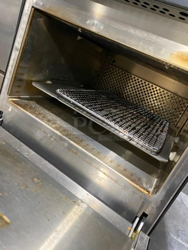 MerryChef Eikon E2S countertop rapid cook oven, electric powered, black, interior view with grilling rack, 208/240V, used condition.