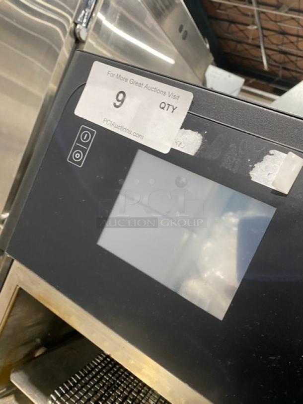 MerryChef Eikon E2S rapid cook oven, black, electric, 208/240V, 1 phase. Visible auction tag indicates model and quantity.