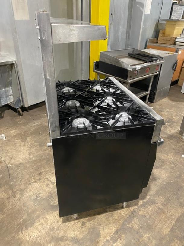 Vulcan stainless steel gas-powered 6-burner range/oven combo with backsplash, overhead salamander shelf, and wired oven rack.