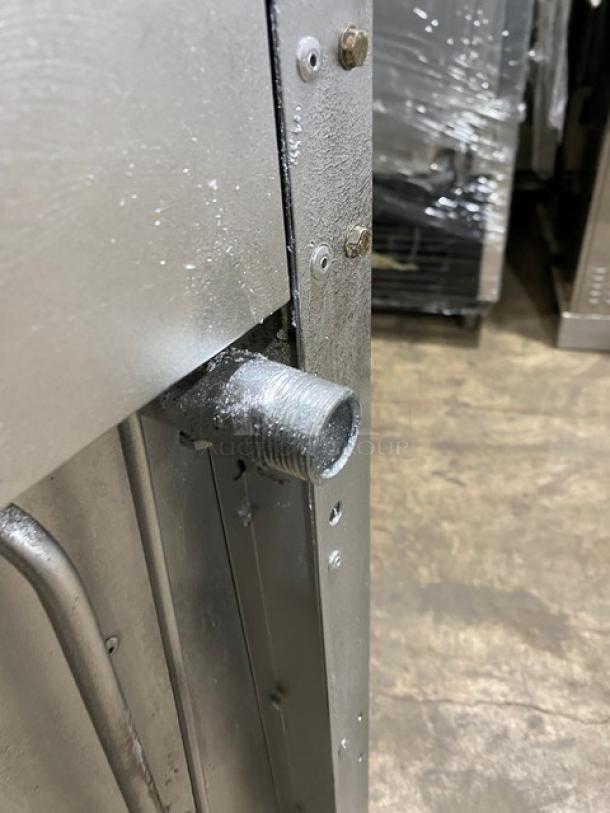 Vulcan stainless steel gas-powered range/oven corner detail, showing gas pipe connection. Condition appears used.