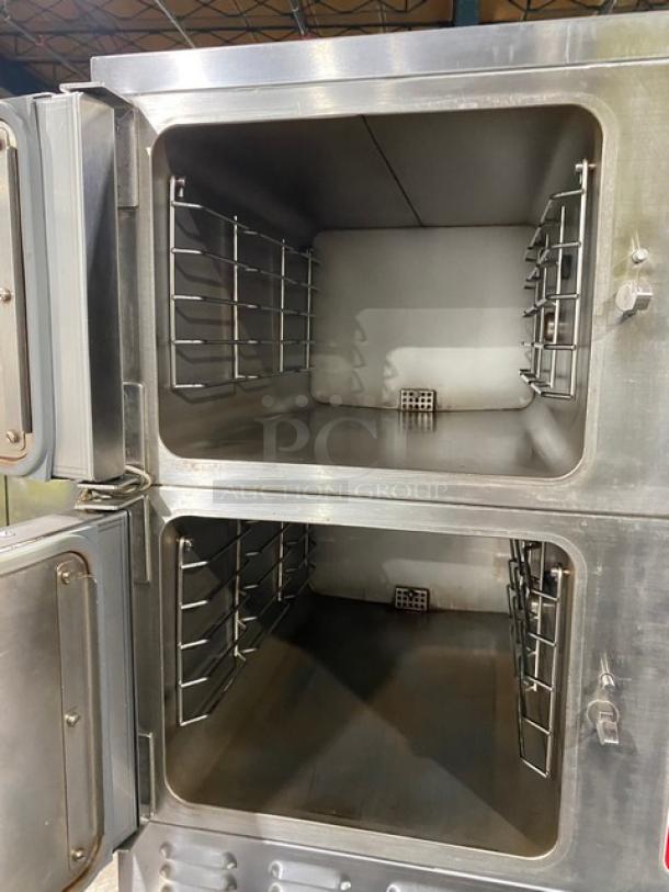 Vulcan VSX24G dual compartment stainless steel convection steamer, natural gas, with pan racks, individual controls, on legs.