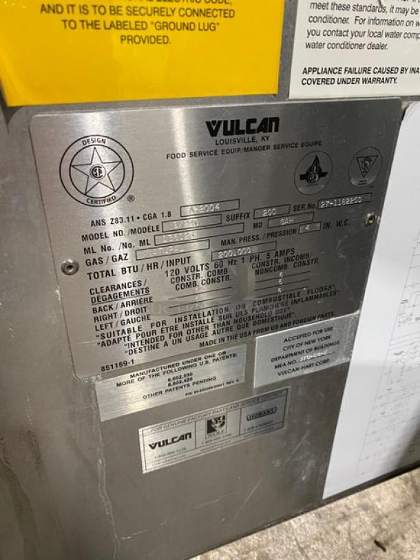 Vulcan VSX24G stainless steel natural gas convection steamer with dual compartments, individual controls, and pan racks. Model details visible.