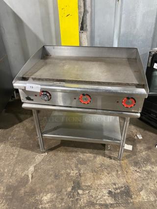 Star Max Series 36" stainless steel electric griddle with back and side splash, single undershelf stand, and legs.