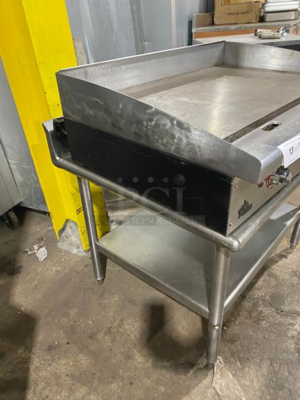 Star Max Series stainless steel 36" electric flat griddle with back and side splash, on single undershelf stand.