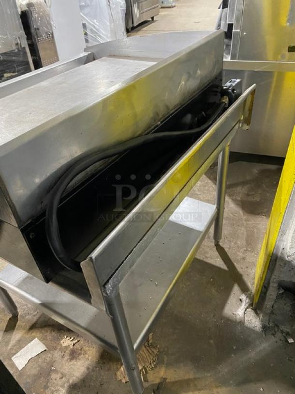 Star Max Series 36" stainless steel electric griddle, with back and side splash, and undershelf equipment stand. Attached power cord.