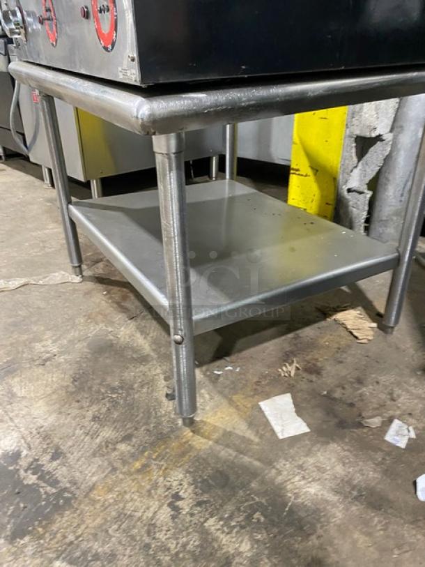 Star Max Series 36" stainless steel electric griddle with back and side splash, single undershelf stand, on legs.