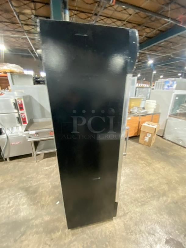 Dukers LG-430F commercial refrigerator, black, single glass swing door, poly coated wire rack, 115V, on legs.